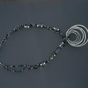 Multi strand beaded necklace with pendant